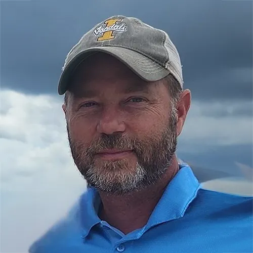 Happy male businessman with a beard and glasses